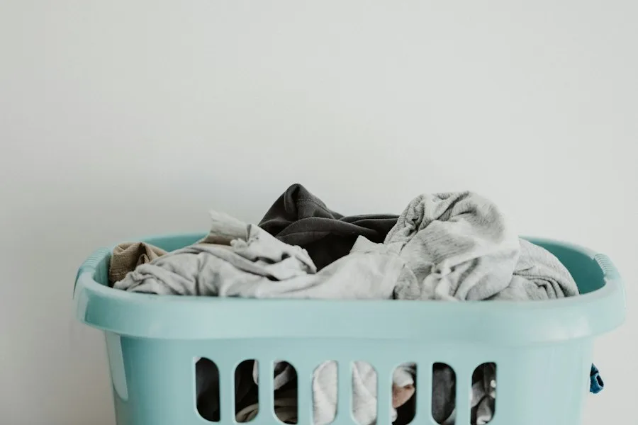 Professional appliance technician troubleshooting a modern clothes dryer in Georgetown